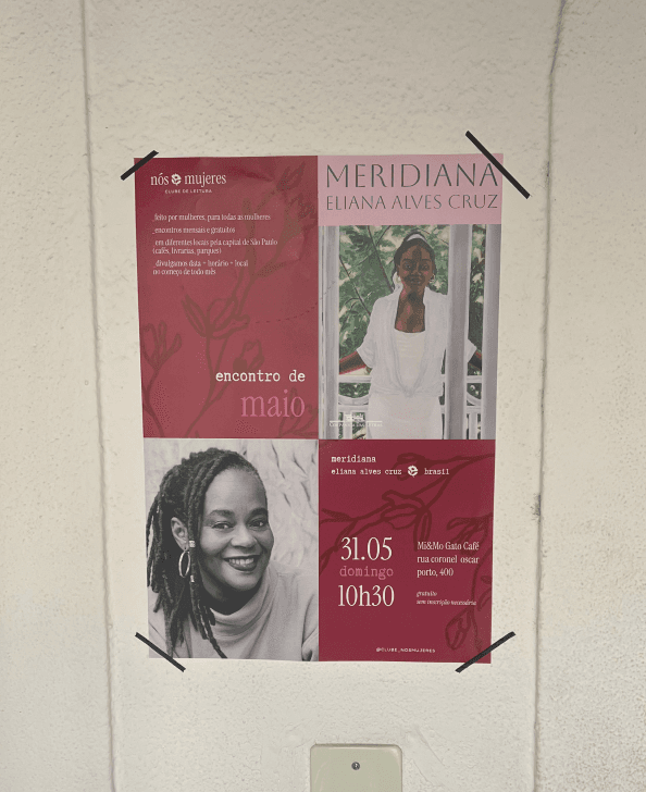 A club poster on the wall of a café