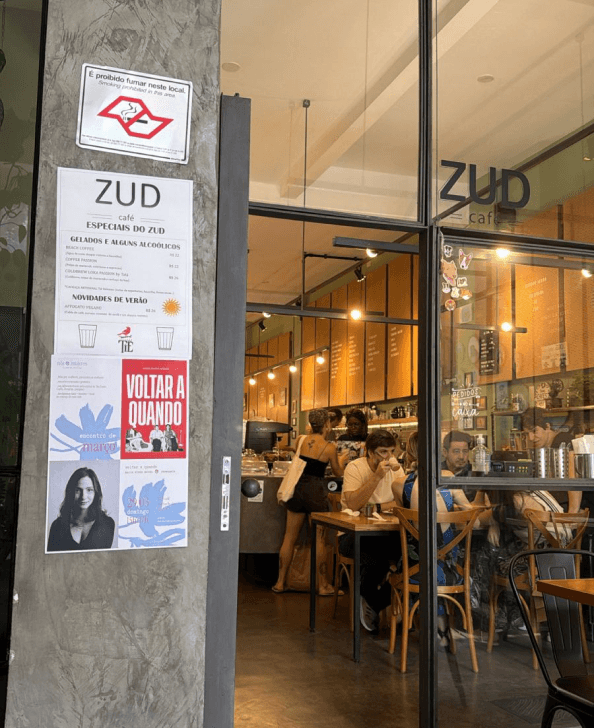 Club posters on the glass front of a café