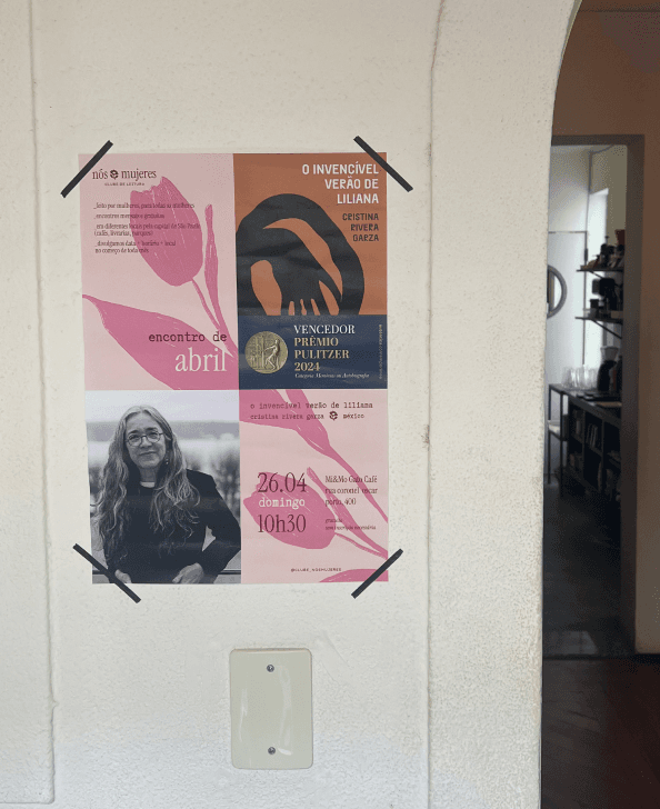 The month's meeting poster next to other flyers
