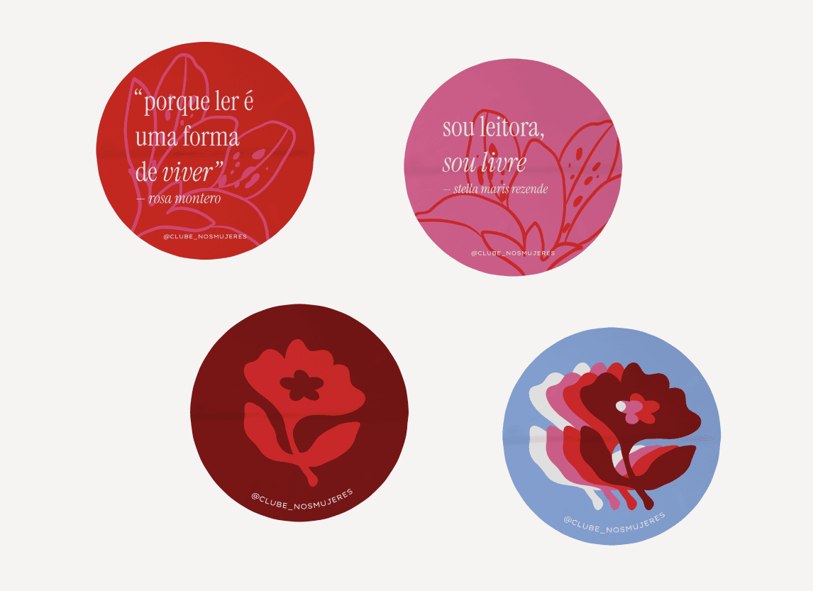 Four round club stickers with quotes and the brand flower, in red, pink, and blue